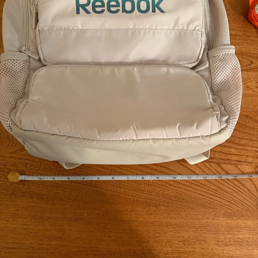 Reebok Adult Laptop Paige Backpack Iridescent Logo, Pumice Stone, Tan Cream Zip